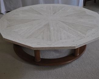 Henredon Travertine vintage dodecagon coffee table round base w/wheels and six columns (50” across x 16” high)
