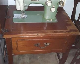 White Sewing Machine with Cabinet. 31 x 23 x 17(closed) 31 x 46 x 17 (open)