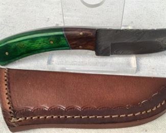 Mfg - Custom Hand Made Damascus
Model - Steel Knife 3.5" Blade
Located in Chattanooga, TN
This lot contains a Custom hand made Damascus steel knife. This knife has a 3.5" blade with an emerald green stained wooden handle, overall length of 8". Full tang design with custom leather embossed sheath.