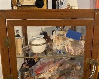 Small antique showcase with antique porcelain dolls 