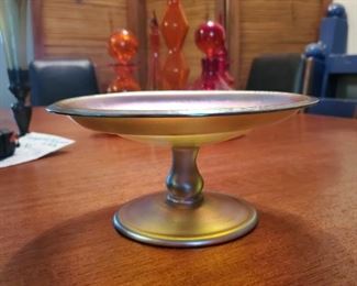 Early Tiffany compote, beautiful colors. Compote is 8 inches across and 3.75 inches high. Bottom is marked L.C.T., Luis Comfort Tiffany.