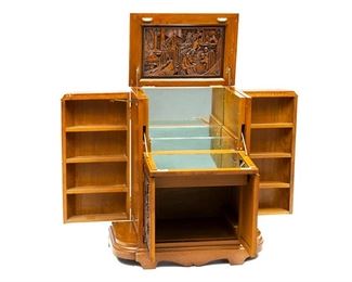 Mid-Century Oriental style cocktail cabinet, drop front door opens to mirrored interior, above two doors, two flanking doors, single drawer, heavily carved Asian motif
41"h x 35"w x 19"d
