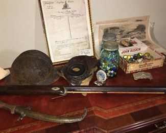 WW 2 French helmet, WW 1 Aviator helmet, fine old marbles and can you see the discharge papers from Napoleon's army?