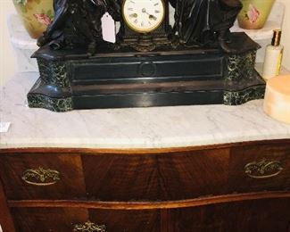 marble top table and the first of many early fine old clocks