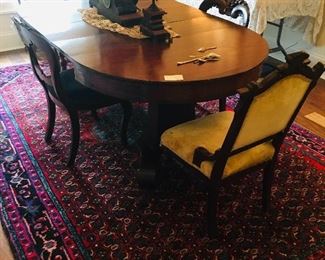 fine old pedestal dining table and Eastlake upholstered chairs--Notice the gorgeous hand knotted rug
