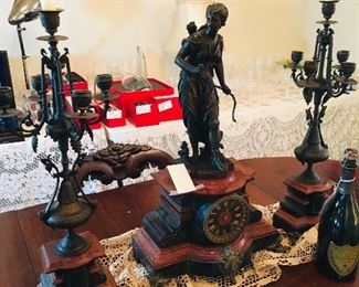 early French garniture (includes  clock  with goddess Diana and candelabra pair)