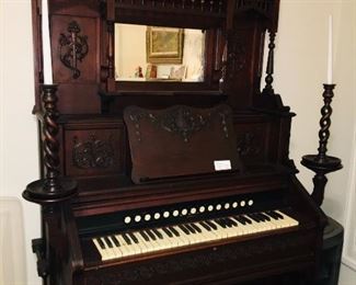 pump organ with candle stands