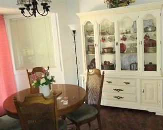 Cute dining table with leaves to expand and a white Hutch.