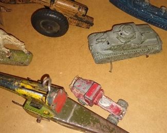 Toy tanks and other weapons some 10 some metal some plastic