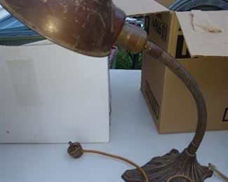 Antique gooseneck lamp.
