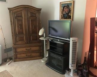 Armoire, Floor Lamps, TV, Needlepoint Picture, Bionaire Tower Fan
