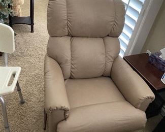 Lazy Boy swivel rocker and recliner manually.  Leather surface and very confrontable