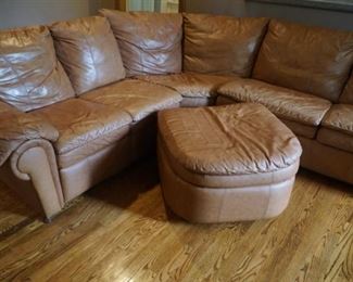 Leather curved hideabed sectional with ottoman