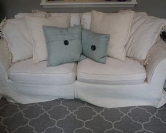 7ft fabric sofa with pillows  (Has a few stains)