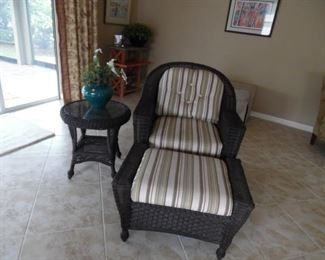 All Weather Wicker Chair & Ottoman. 1 Small Round Table with Glass Top.  3 Piece Set