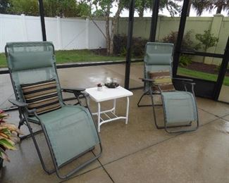 2 Gravity Chairs, small metal table