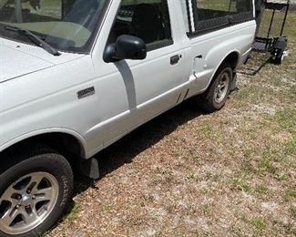 1998 Mazda 2500 pickup with cap