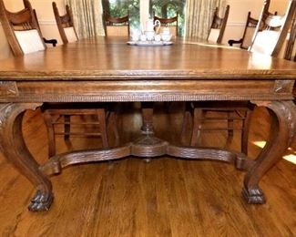 Antique Dining Table with beautifully carved legs, with 4 leaves