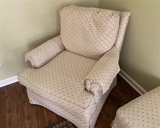 one of a pair of club chairs and one ottoman
