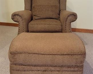 Upholstered Armchair with matching ottoman.