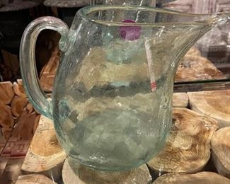 Two hand blown glass pitchers are available