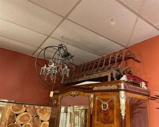Hanging chandelier and three fireplace grates