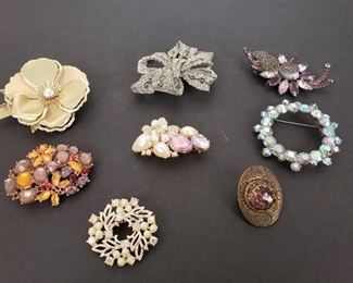 8 brooches