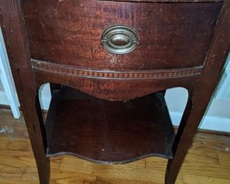 One of two mahogany nightstands