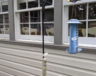 The bird feeder is metal