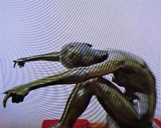 Bronze with gold patina is off site she is in a yoga position for a cocktail glass table top Off site she weighs 150 lbs and can be shipped. call for details table is not at sale.