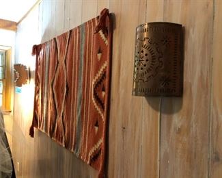 Southwestern decor (copper sconce, clay sconce and wool horse blanket)
