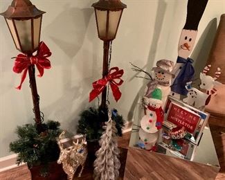 2 vintage electric floor lanterns both for $25
Wood snowman $10
Metal box table $10