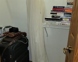 Curtains, luggage and books