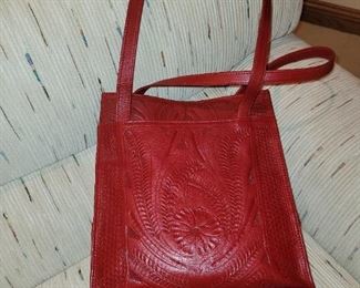 $35.00, Red hand tooled leather purse Excellent condition 26"
