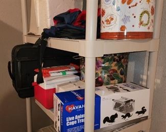 Rodent trap, tins plastic shelving and luggage