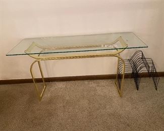 #10	brass/base glass top sofa table 50x18x26	 $65.00 
