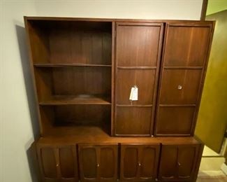 #25	Mid Century display cabinet with 6 doors (4 working and 2 panels)  3 open  shelves and 4 shelves behind the doors (from Denmark in 1960's) 60x17x76	 $800.00 
