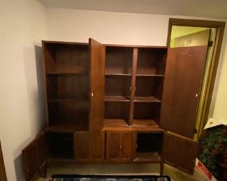 #25	Mid Century display cabinet with 6 doors (4 working and 2 panels)  3 open  shelves and 4 shelves behind the doors (from Denmark in 1960's) 60x17x76	 $800.00 
