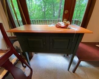 #47	green painted cabinet on legs with 2 doors and wood top 40x18x35	 $100.00 
