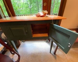 #47	green painted cabinet on legs with 2 doors and wood top 40x18x35	 $100.00 
