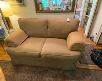 #58	Beautyrest tan love seat 66 long with loose back cushion (dog) 	 $65.00 
