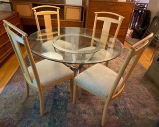 #56	round glass top table with stainless base with wood ball in middle 46x27 w 4 maple tan fabric seat chairs	 $250.00 
