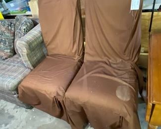 #76	(2) parson chairs with brown slip covers $20 ea. 	 $40.00 
