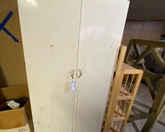 #87	white metal cabinet with 2 doors and 4 shelves 30x16x63	 $75.00 
