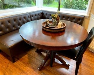 Cozy Breakfast nook with table. This upholstered corner breakfast nook set features elegant diamond tufting on the seat backs and is supported by tapered wood legs. Includes three pieces: a corner unit, a short section and a long section. Tufted back. Eucalyptus wood legs in dark brown finish.
Dimensions of the nook-
Corner: 31.75"H x 28.5"W x 28"D.
Short section: 31.75"H x 34"W x 28"D.
Long section: 31.75"H x 46"W x 28"D.
The pedestal Dining Table in Cherry rubber wood finish with detailed trimmed-around the legs . Dimensions of the table - 48” diameter 30” high