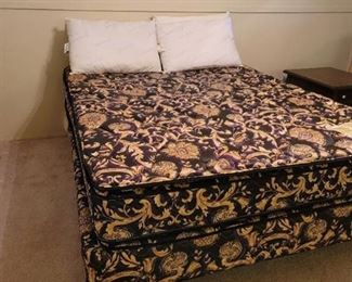 Sleeptronic Queen Size Bed with 4 Pillows. Located in walkout basement.
