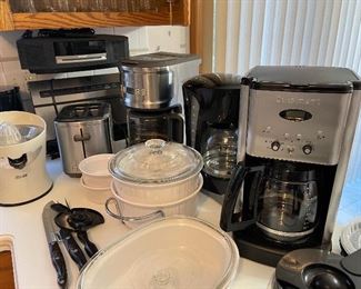 Tons of kitchen items and coffee makers 