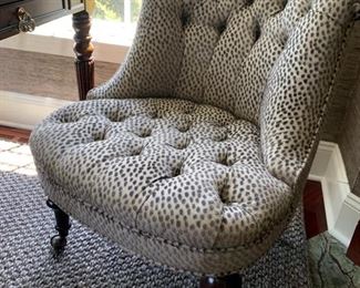 79. Pair of Tufted Animal Print Chairs on Casters