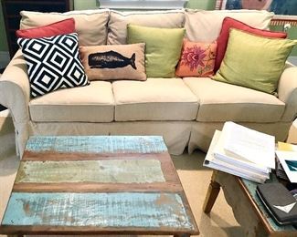 Neutral sofa and painted tables