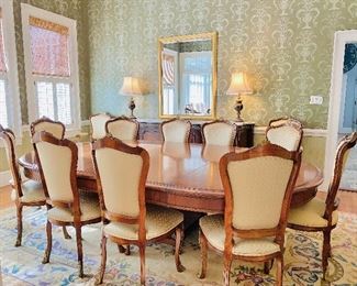19th c. French dining table and 12 chairs with gilt ormolu.  Purchased from Clement’s Antiques in Dallas